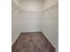 Walk-in closet with wire shelving and plush carpeting at 525 Parkway Dr Ne # 305, Atlanta, GA 30308