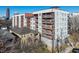 Modern apartment building exterior with balconies and large windows, showcasing urban living at its finest at 525 Parkway Dr Ne # 305, Atlanta, GA 30308