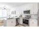 Bright, modern kitchen featuring white cabinets, stainless steel appliances, and granite countertops at 525 Parkway Dr Ne # 305, Atlanta, GA 30308