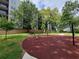 Outdoor playground area with modern equipment surrounded by lush greenery, perfect for Gathering fun at 525 Parkway Dr Ne # 305, Atlanta, GA 30308