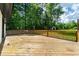 Wooden deck overlooking the backyard at 550 Oglesby Bridge Se Rd, Conyers, GA 30094