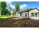 Backyard with house and patio at 550 Oglesby Bridge Se Rd, Conyers, GA 30094