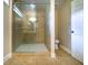 Bathroom featuring a tiled shower with a sliding glass door at 550 Oglesby Bridge Se Rd, Conyers, GA 30094