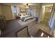 Bedroom with gray wood-look floors, ceiling fan, and neutral walls provides a calming retreat at 550 Oglesby Bridge Se Rd, Conyers, GA 30094