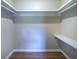 A closet with shelving and wood floors and neutral walls at 550 Oglesby Bridge Se Rd, Conyers, GA 30094