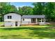 Back exterior of home and yard at 550 Oglesby Bridge Se Rd, Conyers, GA 30094