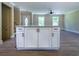 Kitchen island featuring a stone countertop with breakfast bar in an open-concept living area at 550 Oglesby Bridge Se Rd, Conyers, GA 30094