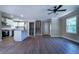 Bright and open living area with stairs to second floor and kitchen beyond at 550 Oglesby Bridge Se Rd, Conyers, GA 30094