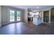 The spacious living room connects to the kitchen and has doors to the backyard at 550 Oglesby Bridge Se Rd, Conyers, GA 30094