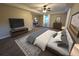 Spacious main bedroom with hardwood floors, ceiling fan, and desk at 550 Oglesby Bridge Se Rd, Conyers, GA 30094