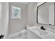 Bathroom with modern sink, marble countertop, and white walls at 1461 Leach Dr, Lawrenceville, GA 30045