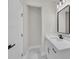Bathroom with a white marble vanity, black hardware and faucets, and marble floors at 1461 Leach Dr, Lawrenceville, GA 30045