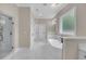 Spa-like bathroom features a soaking tub, walk-in shower and dual vanities at 1461 Leach Dr, Lawrenceville, GA 30045