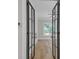 Bedroom through modern, black-framed glass double doors at 1461 Leach Dr, Lawrenceville, GA 30045