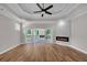 Primary bedroom with a tray ceiling, fireplace and access to a private deck at 1461 Leach Dr, Lawrenceville, GA 30045