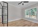 Bedroom with black-framed glass door and outside view at 1461 Leach Dr, Lawrenceville, GA 30045