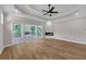 Bright primary bedroom with wood floors, fireplace and deck access at 1461 Leach Dr, Lawrenceville, GA 30045