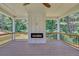 Covered deck featuring a wood-burning fireplace at 1461 Leach Dr, Lawrenceville, GA 30045
