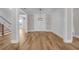 Dining room showcasing hardwood floors, a decorative chandelier, and white wall accents at 1461 Leach Dr, Lawrenceville, GA 30045