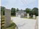 Long driveway leading to a beautifully designed home with an attached three-car garage at 1461 Leach Dr, Lawrenceville, GA 30045