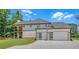 Exterior showing a 3 car garage, with a modern design, and an expansive lawn at 1461 Leach Dr, Lawrenceville, GA 30045