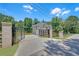 Exterior view of the home showcasing a gated entrance leading to the driveway and garage at 1461 Leach Dr, Lawrenceville, GA 30045