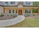 Charming front porch with wooden columns, brick accents, and double doors at 1461 Leach Dr, Lawrenceville, GA 30045