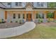 Inviting front porch with wooden columns, brick accents, and elegant double front doors at 1461 Leach Dr, Lawrenceville, GA 30045