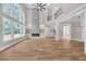 Spacious living room boasting tall ceilings, large windows, and a fireplace with stylish stone decor at 1461 Leach Dr, Lawrenceville, GA 30045