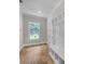 Mudroom area with white cabinetry, bench and window at 1461 Leach Dr, Lawrenceville, GA 30045