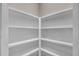 Walk-in pantry with white walls and shelving offers ample storage space at 1461 Leach Dr, Lawrenceville, GA 30045