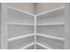 Walk-in pantry with white shelves at 1461 Leach Dr, Lawrenceville, GA 30045