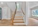 Staircase with wooden steps, iron railing, and window at 1461 Leach Dr, Lawrenceville, GA 30045