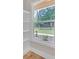 Natural light streams into a room with white trim highlighting the window view of the outdoors at 1461 Leach Dr, Lawrenceville, GA 30045