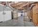 Unfinished basement with concrete flooring and exposed ceiling at 2151 Hamstead Ct, Suwanee, GA 30024
