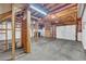 Unfinished basement with exposed ceiling and concrete flooring at 2151 Hamstead Ct, Suwanee, GA 30024