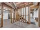 View of unfinished basement area with wooden beams and concrete floor at 2151 Hamstead Ct, Suwanee, GA 30024