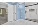 Bathroom featuring a glass-enclosed shower, a doorway to the main bedroom, and blue wall paint at 2151 Hamstead Ct, Suwanee, GA 30024