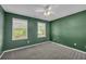 Cozy bedroom with two windows, ceiling fan and plush carpeting at 2151 Hamstead Ct, Suwanee, GA 30024