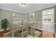 Elegant dining room with hardwood floors, decorative moldings, and ample natural light at 2151 Hamstead Ct, Suwanee, GA 30024