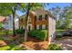 Two-story home with brick and siding exterior and well-maintained landscaping at 2151 Hamstead Ct, Suwanee, GA 30024