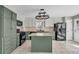 Spacious kitchen with green cabinets, stainless steel appliances, and a center island at 2151 Hamstead Ct, Suwanee, GA 30024