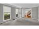 Cozy living room with plush carpet, natural light, and an open doorway to the foyer at 2151 Hamstead Ct, Suwanee, GA 30024