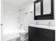 Bathroom features a shower-tub combination and a double sink vanity with dark cabinets at 2901 Lenox Ne Way # 902, Atlanta, GA 30324