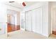 Bright bedroom features glass paneled doors and access to another room and a closet at 2901 Lenox Ne Way # 902, Atlanta, GA 30324