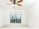 Bright bedroom features a ceiling fan and large window offering natural light at 2901 Lenox Ne Way # 902, Atlanta, GA 30324