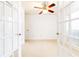Bright bedroom features glass paneled doors and a window offering natural light at 2901 Lenox Ne Way # 902, Atlanta, GA 30324