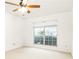 Bright bedroom features a ceiling fan and large window offering natural light at 2901 Lenox Ne Way # 902, Atlanta, GA 30324