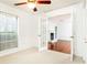 Bright bedroom featuring a ceiling fan and double doors leading to another room at 2901 Lenox Ne Way # 902, Atlanta, GA 30324