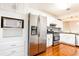 Modern kitchen with stainless steel appliances, granite countertops, and white cabinets at 2901 Lenox Ne Way # 902, Atlanta, GA 30324